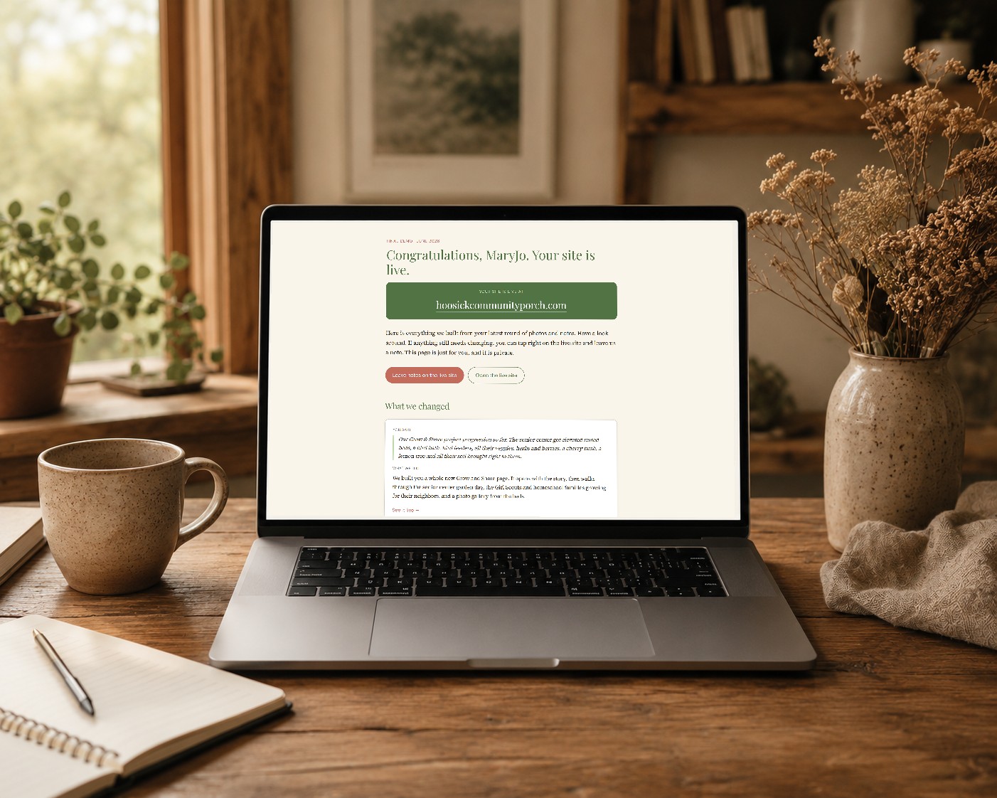 A laptop on a wooden desk showing a private client review page that opens with the client's name.